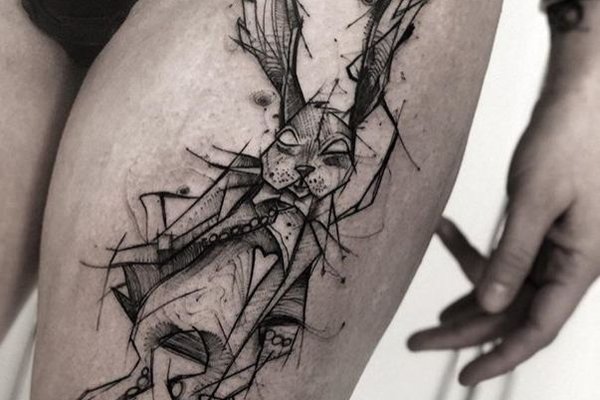 sketch of a tattoo on a woman's thigh