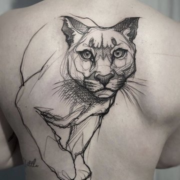 sketch of a cougar tattoo on his back.
