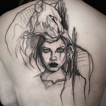 sketch tattoo with a portrait on the back