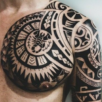 Polynesian style tribal tattoo on shoulder